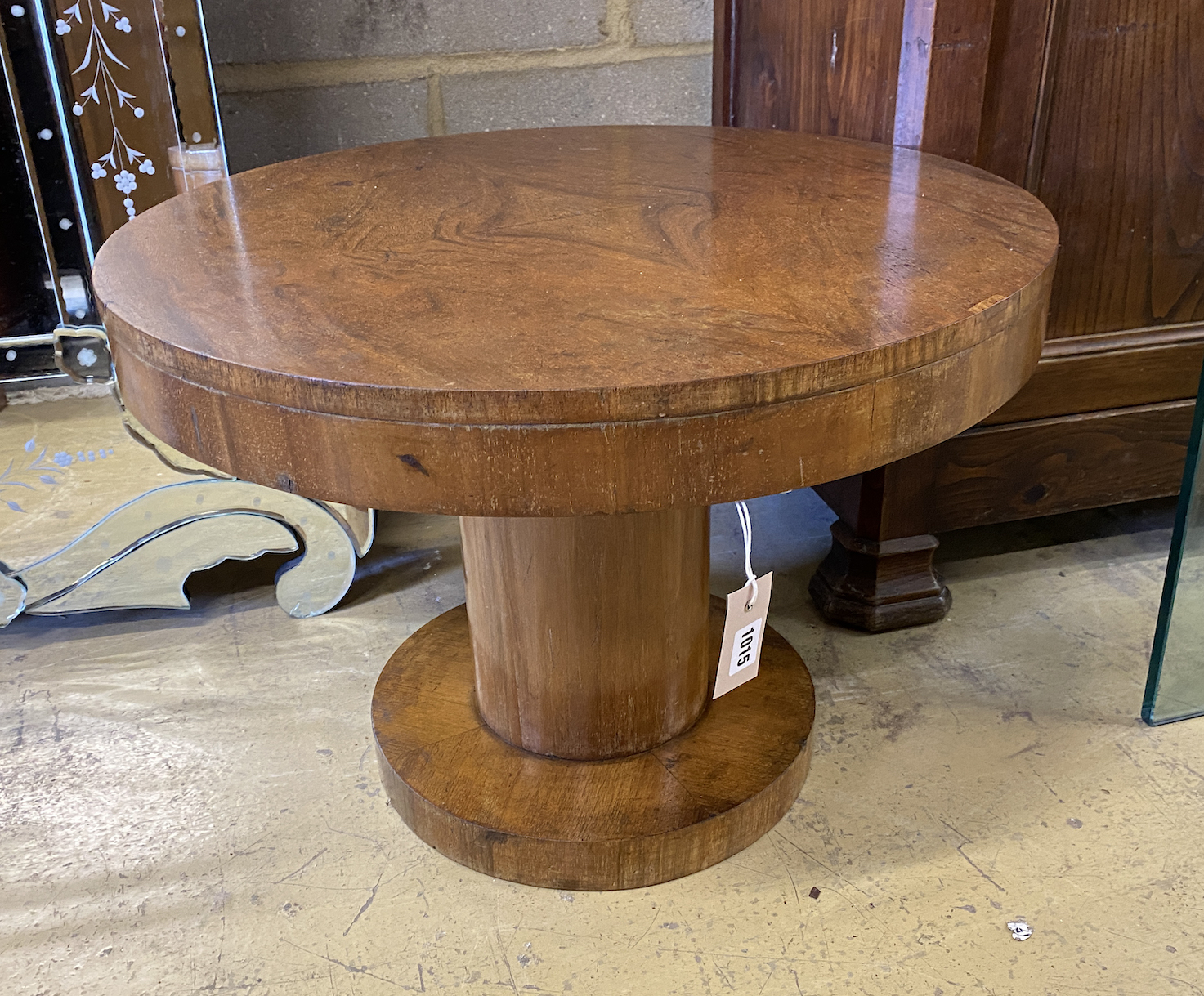 An Art Deco style circular walnut low table, diameter 62cm, height 44cm